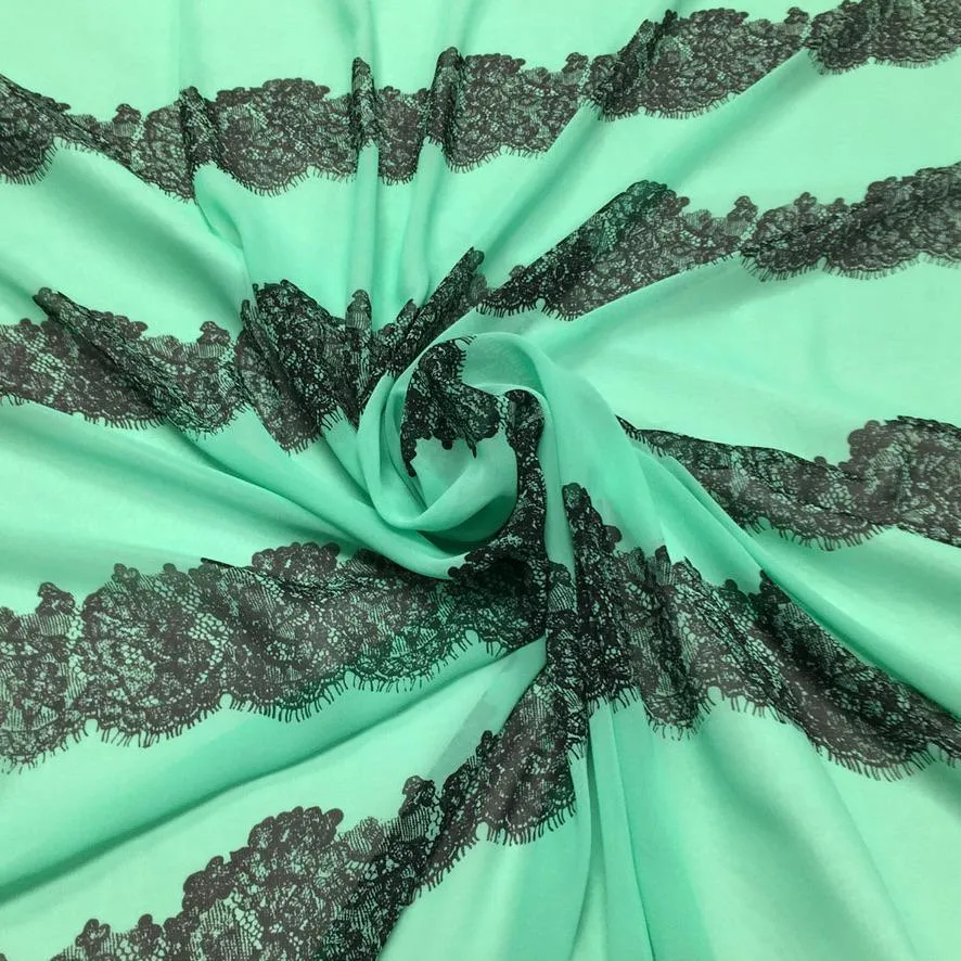 Black Lace Design on Pale Mint Chiffon Fabric